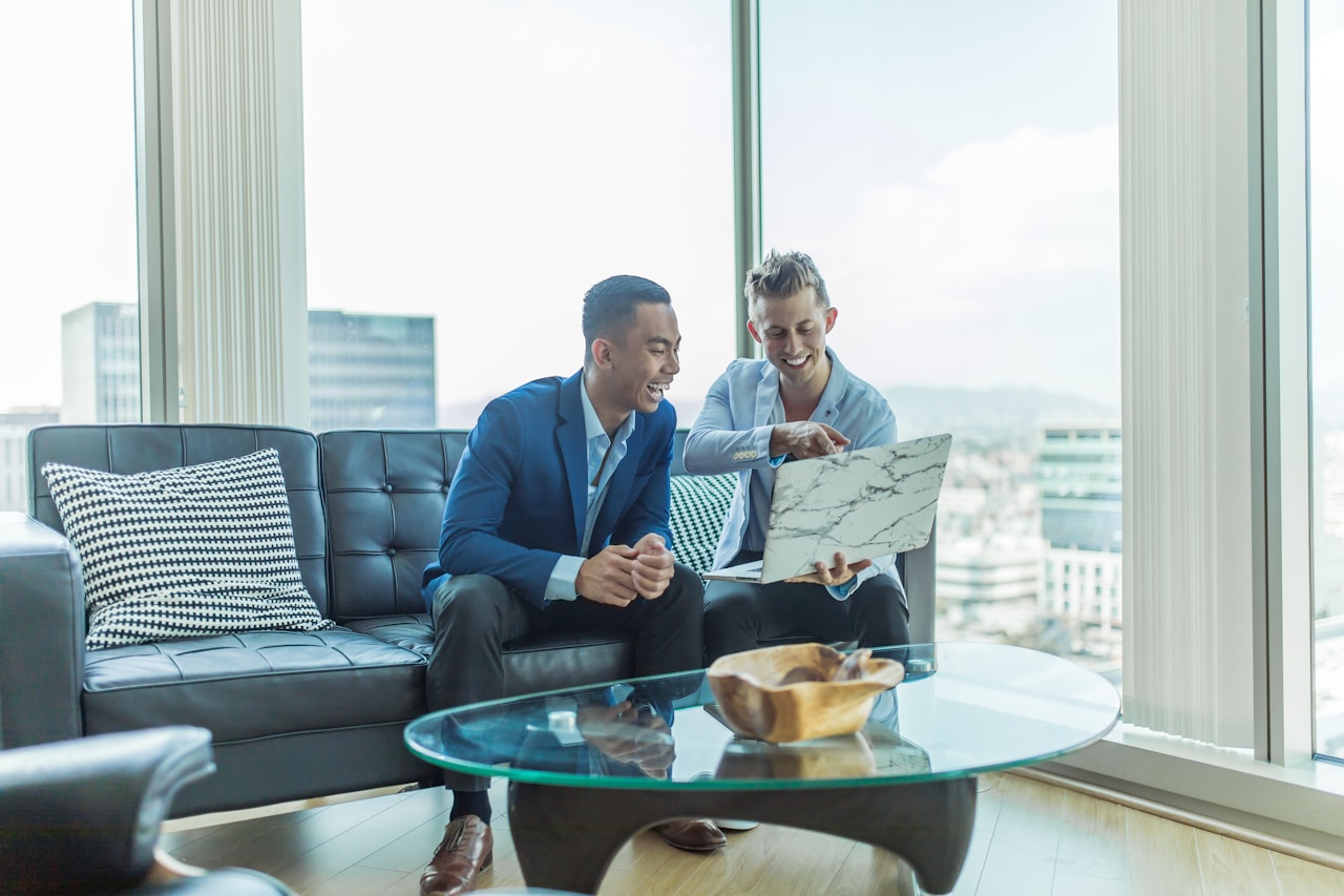 Two people reviewing financial documents